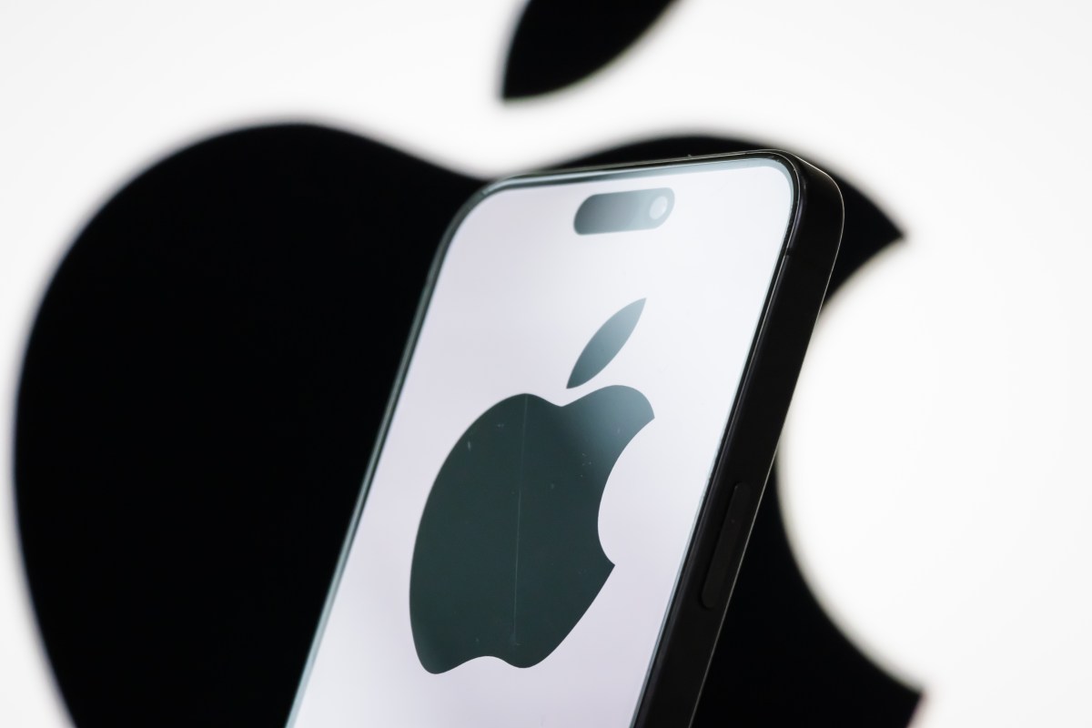 apple-on-phone.jpg In this photo illustration, the logo of Apple Inc. is displayed on a smartphone screen, with the company's iconic black apple symbol visible in the background.