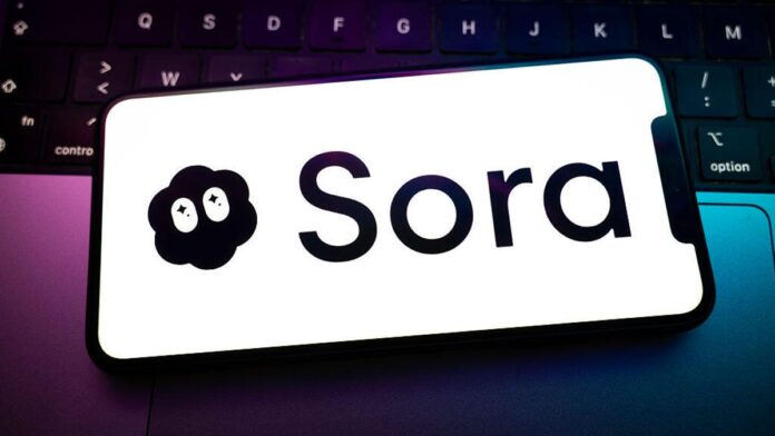 Sora logo on a smartphone resting on a laptop