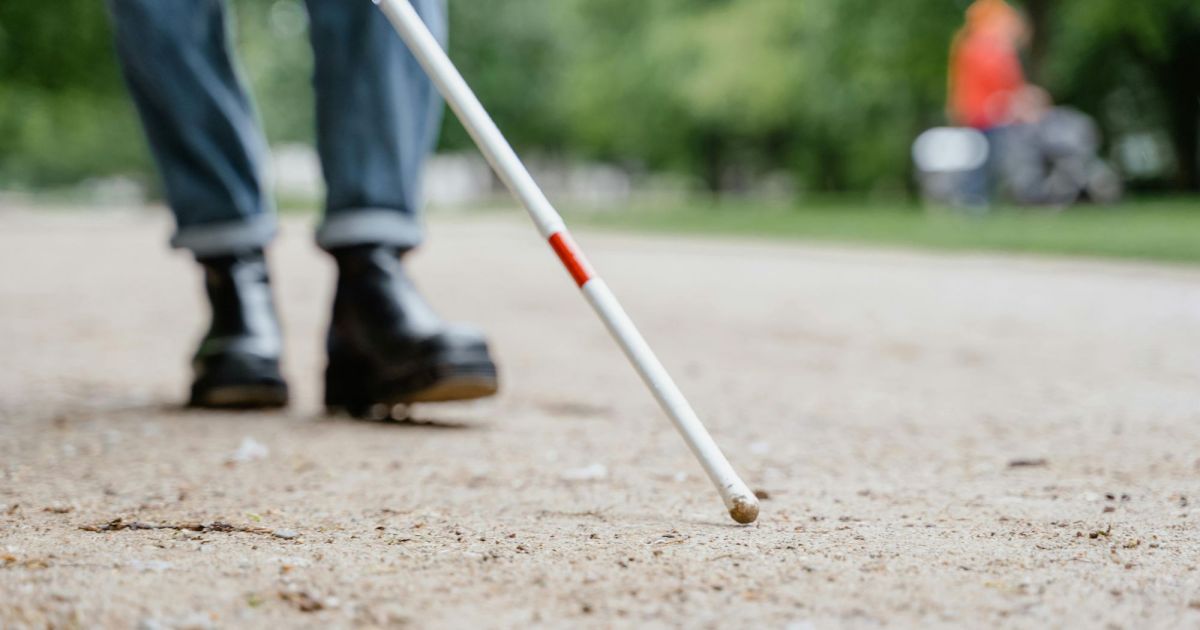 visually-impaired-person-walking-with-stick.jpg This AI app is helping visually impaired people find and navigate objects around them