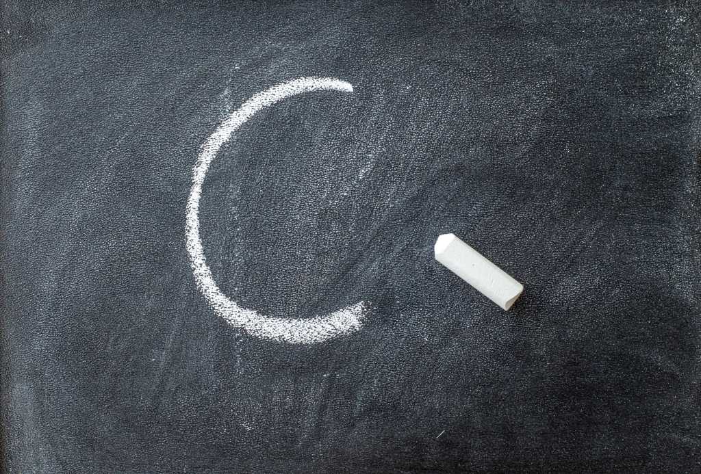 4105028-0-27818500-1765530167-shutterstock_1605668302.jpg The letter C written on a blackboard with chalk stick.