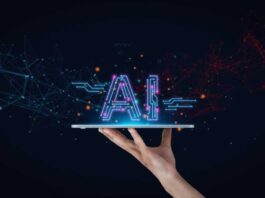 Essential Considerations Before Developing Your First Enterprise AI Application A human hand against a midnight-black background holds a tablet like a platter with the word "AI" resting on top. AI tools, AI technology, AI innovation.
