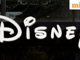 FILE - The Disney logo is seen on their store along the Champs Elysees Avenue in Paris on Sept. 20, 2017. (AP Photo/Francois Mori, File)
