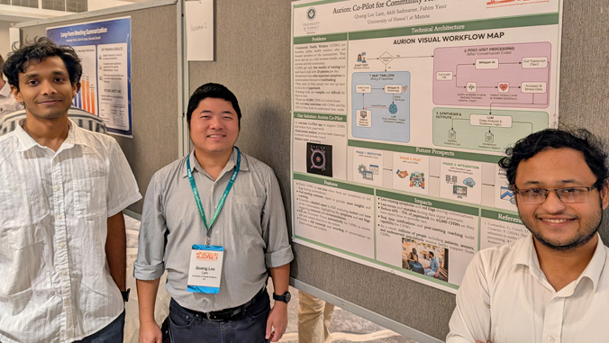 three people standing and smiling next to a posterboard