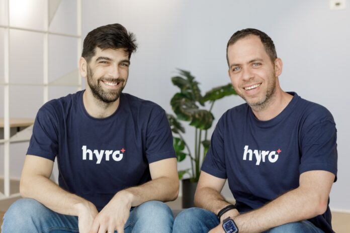 Hyro co-founders Rom Cohen and Israel Kush sitting together