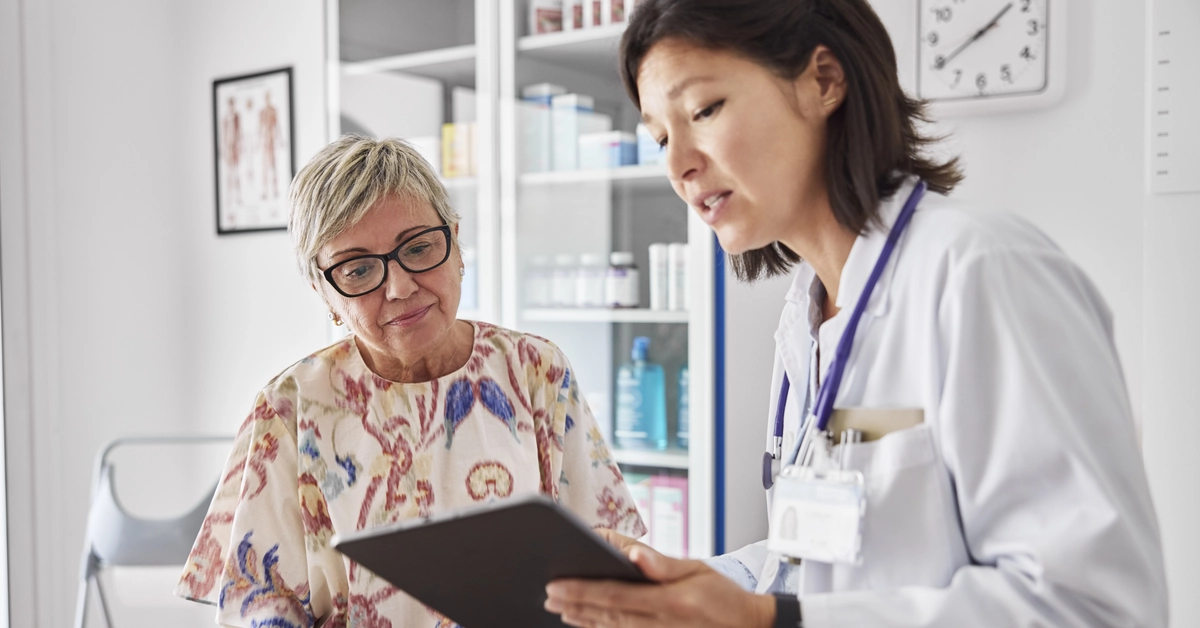 3092464-female-doctor-sharing-electronic-test-results-on-digital-tablet-with-female-patient-at-clini.webp AI survey insights: Newer providers concerned about deskilling