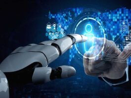 Robot hand and human hand extend toward either side of a virtual touchscreen to click a humanoid figure on the screen.