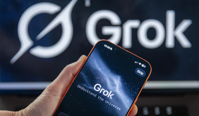 In this photo illustration a iPhone screen displaying the Grok app. Pic: Getty Images