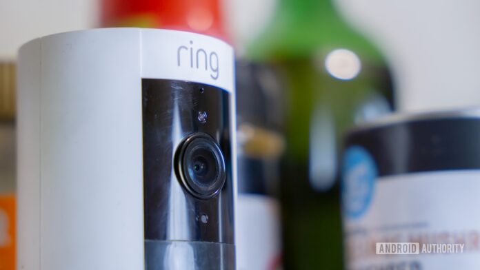 Ring camera next to spices, cans, and more kitchen items stock photo (2)