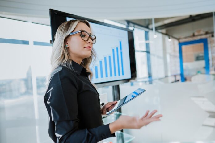A worker explaining a chart.