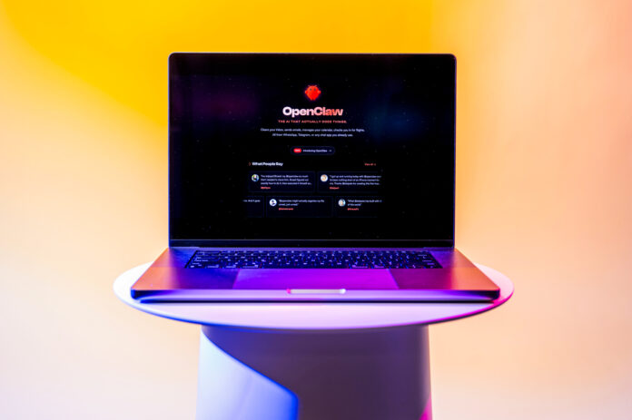 A laptop open on a pedestal to the OpenClaw personal AI assistant screen.