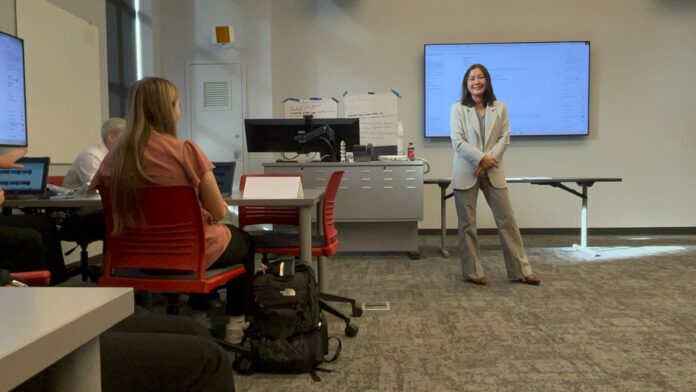 High School students with Dr. Chiharu Ishida participating in AI Hackathon challenge