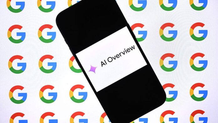 A cellphone with an image on it that reads AI Overview. The AI sparkle precedes the words.
