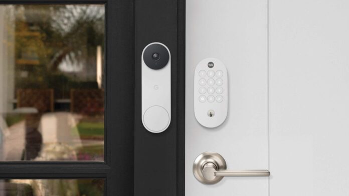 Yale's smart lock on a white door beside a white Nest video doorbell.