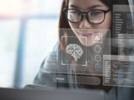 A business woman looking at AI on a transparent screen