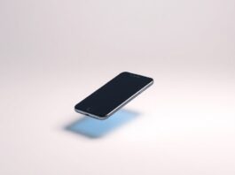 A photorealistic studio still-life image showing a sleek, modern smartphone with a glowing screen floating on a clean, monochromatic background, representing the integration of mobile app growth capabilities into a programmatic advertising platform.