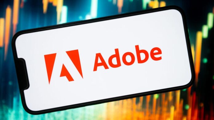 Adobe logo on a smartphone in front of a colorful background